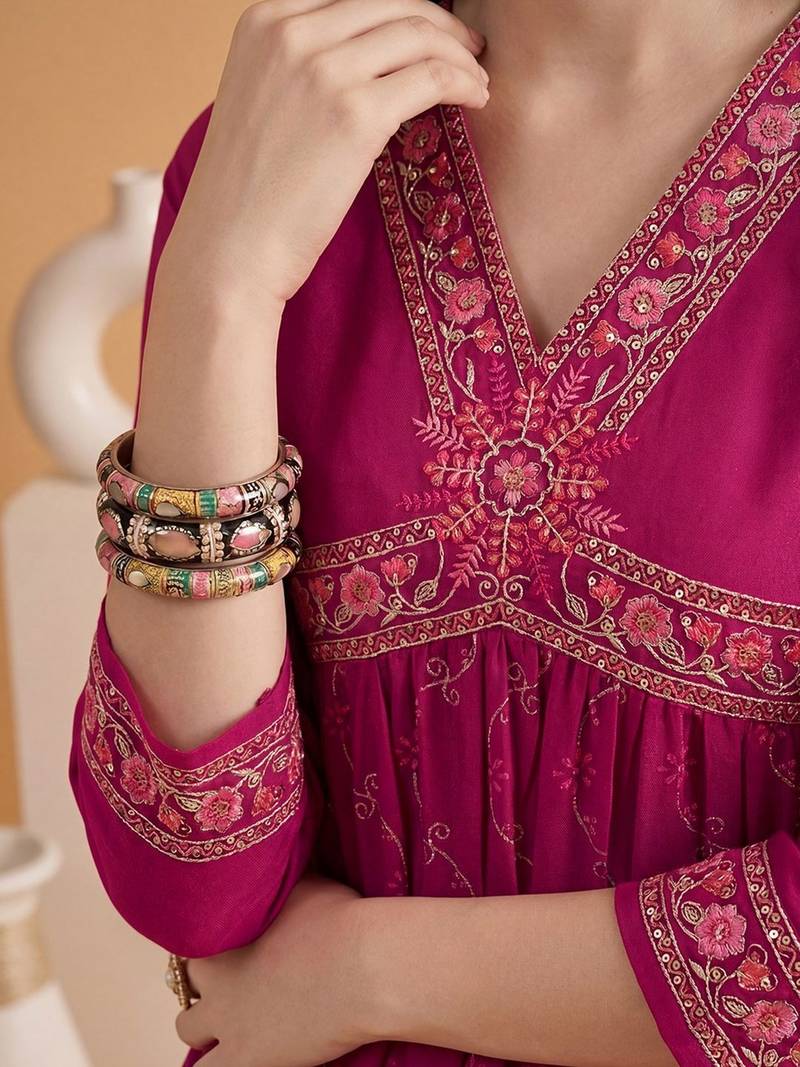 Embroidered v-neck alia cut kurta & trousers
