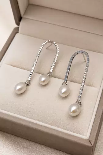 Silver tone freshwater pearl drop earrings, textured arc hook, elegant dangle style