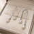 Silver tone freshwater pearl drop earrings, textured arc hook, elegant dangle style