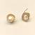 Pearl stud earrings, gold-toned round halo with cz stones, elegant tops