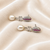 Pearl drop earrings with ruby red cz marquise stud and baguette crystal, silver tone