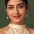 Gold-toned pearl drop earrings with crystal-studded hoop, teardrop frame, elegant dangle style
