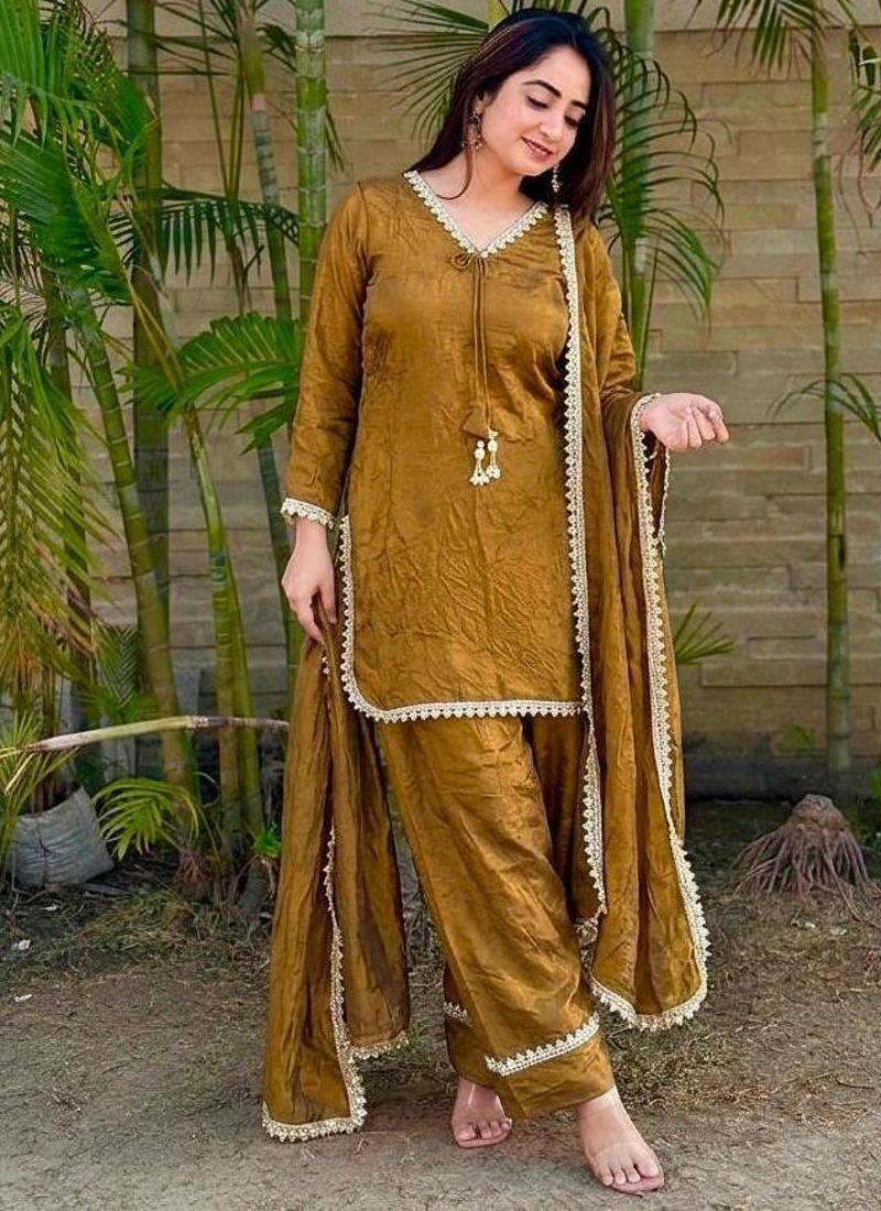 New trendy elegant gold chanderi silk kurta set with delicate lace detailing and matching dupatta