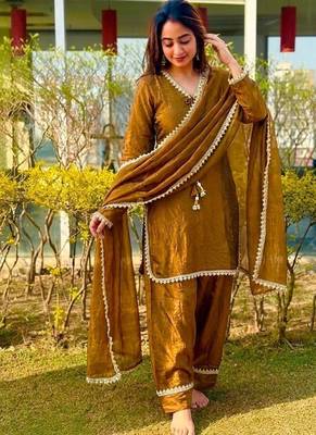  gold chanderi silk kurta set with delicate lace detailing and matching dupatta 2