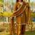 New trendy elegant gold chanderi silk kurta set with delicate lace detailing and matching dupatta