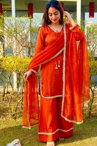 New trendy elegant orange chanderi silk kurta set with delicate lace detailing and matching dupatta