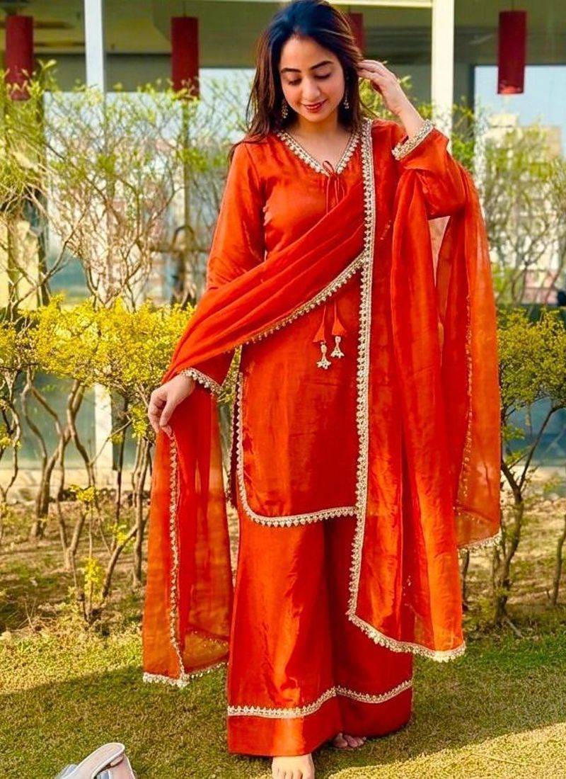 New trendy elegant orange chanderi silk kurta set with delicate lace detailing and matching dupatta