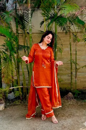 New trendy elegant orange chanderi silk kurta set with delicate lace detailing and matching dupatta