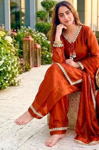 New trendy elegant orange chanderi silk kurta set with delicate lace detailing and matching dupatta