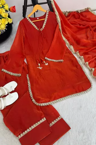 New trendy elegant orange chanderi silk kurta set with delicate lace detailing and matching dupatta