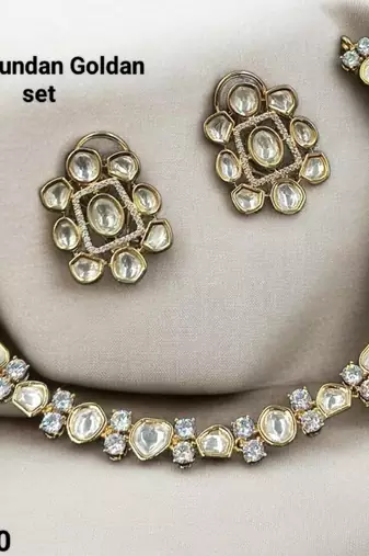 White color kundan & ad stone necklace set with earrings, gold plated