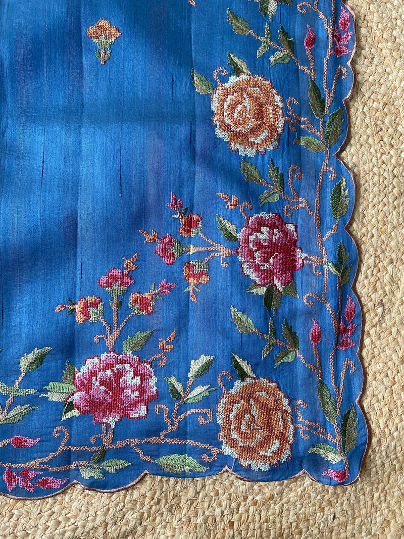 Blue matka silk saree with heavy floral embroidery border with running blouse