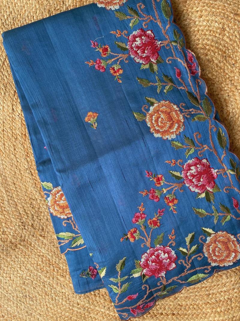 Blue matka silk saree with heavy floral embroidery border with running blouse
