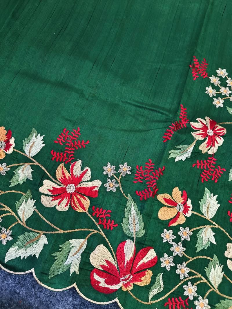 Green matka silk saree with heavy floral embroidery border with running blouse