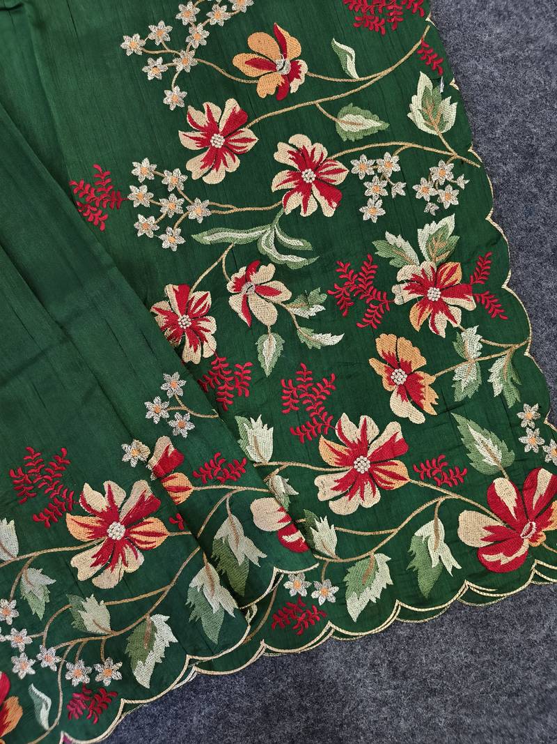 Green matka silk saree with heavy floral embroidery border with running blouse