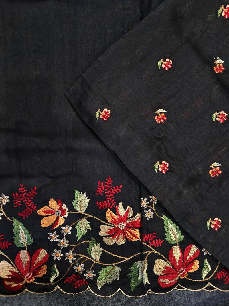 Black matka silk saree with heavy floral embroidery border with running blouse
