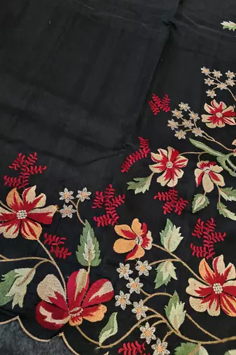 Black matka silk saree with heavy floral embroidery border with running blouse