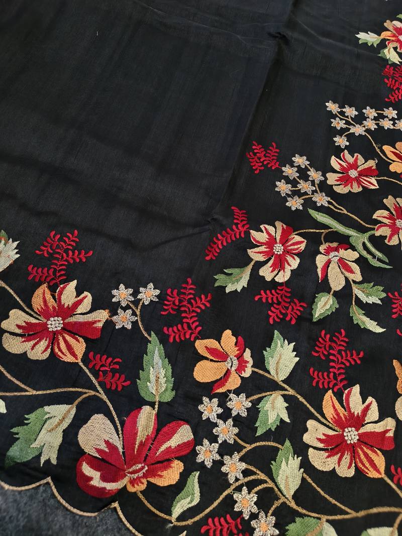 Black matka silk saree with heavy floral embroidery border with running blouse