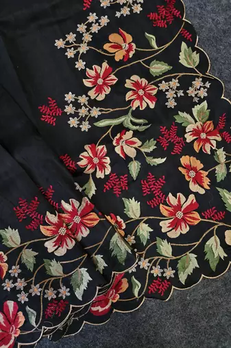 Black matka silk saree with heavy floral embroidery border with running blouse
