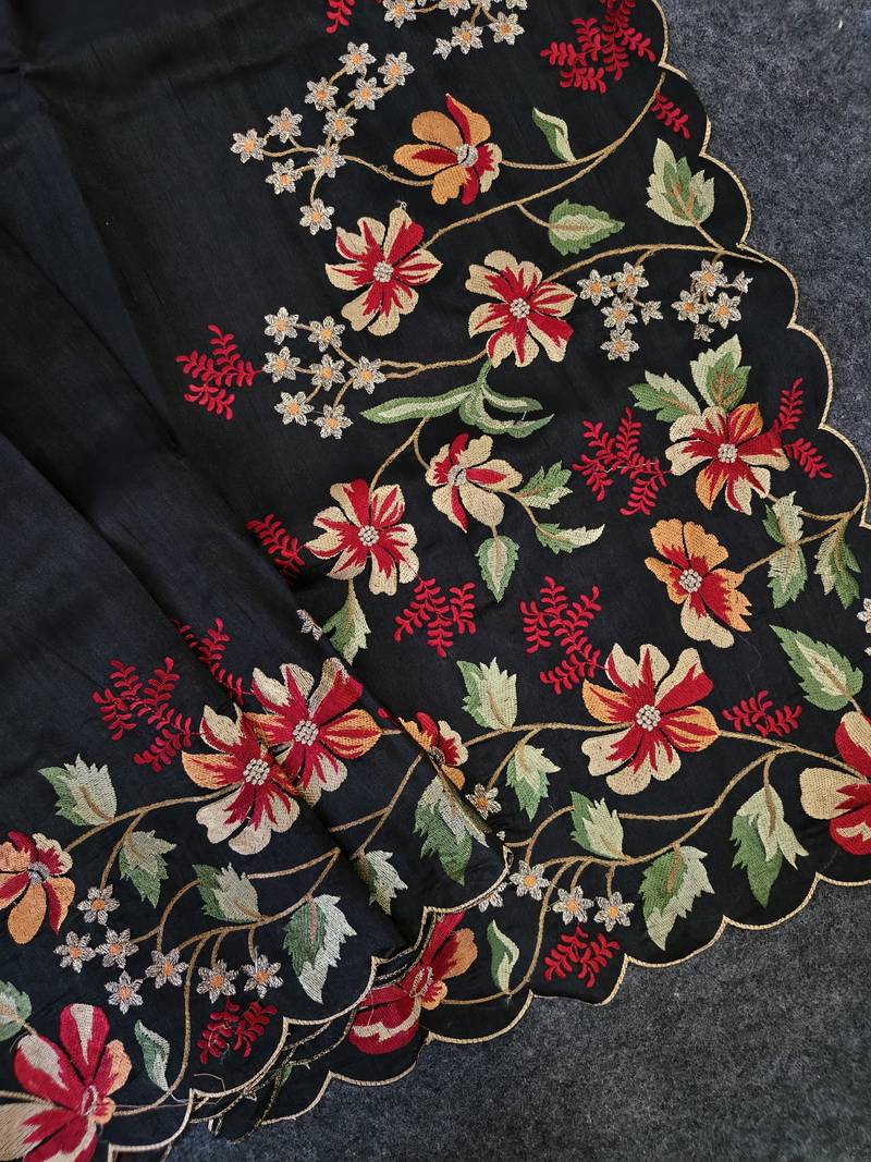 Black matka silk saree with heavy floral embroidery border with running blouse