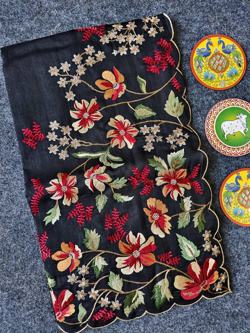 Black matka silk saree with heavy floral embroidery border with running blouse