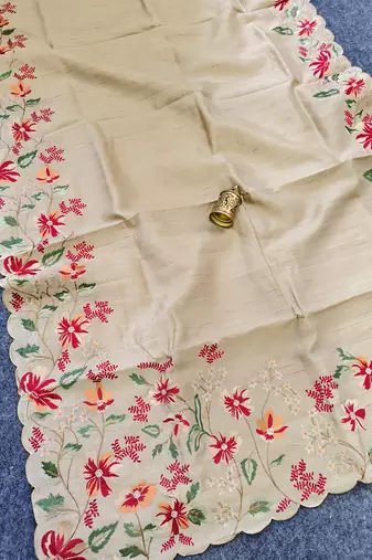 Cream matka silk saree with heavy floral embroidery border with running blouse