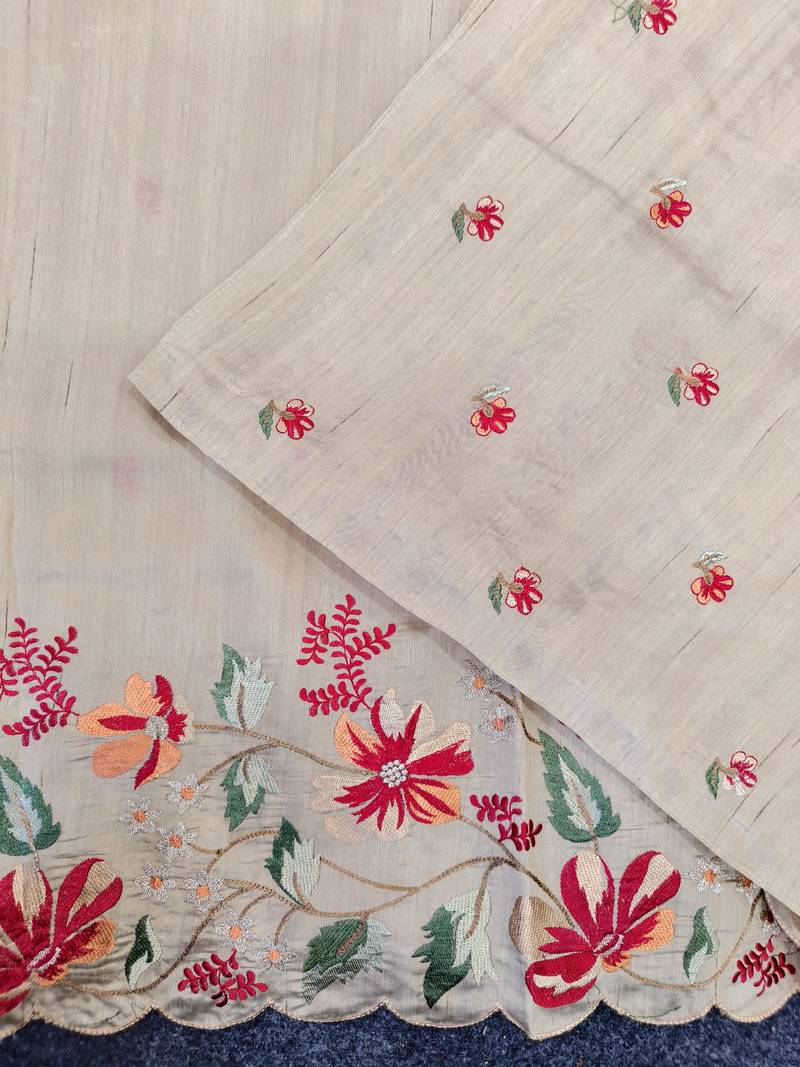 Cream matka silk saree with heavy floral embroidery border with running blouse