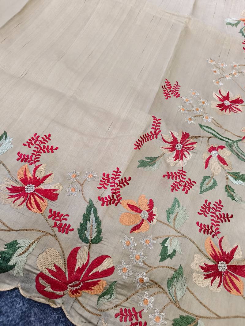 Cream matka silk saree with heavy floral embroidery border with running blouse