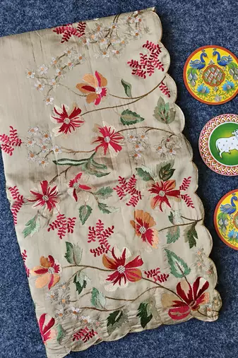 Cream matka silk saree with heavy floral embroidery border with running blouse