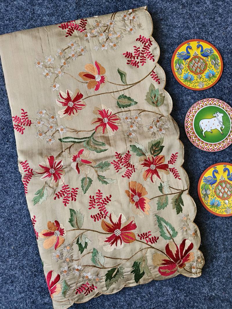 Cream matka silk saree with heavy floral embroidery border with running blouse