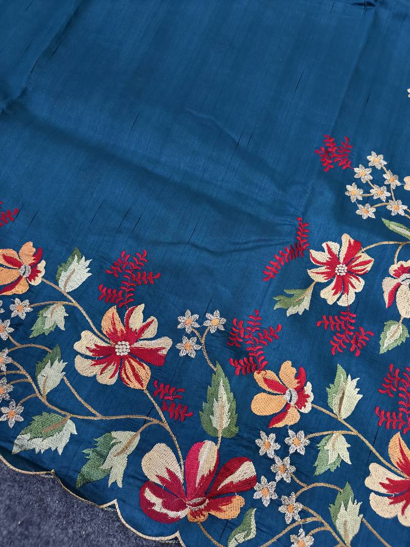 Blue matka silk saree with heavy floral embroidery border with running blouse