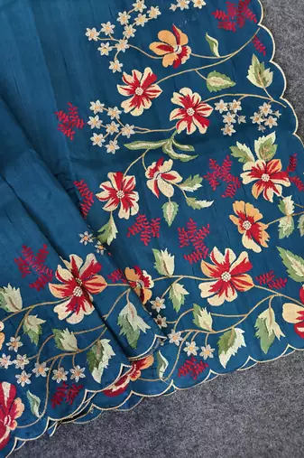 Blue matka silk saree with heavy floral embroidery border with running blouse
