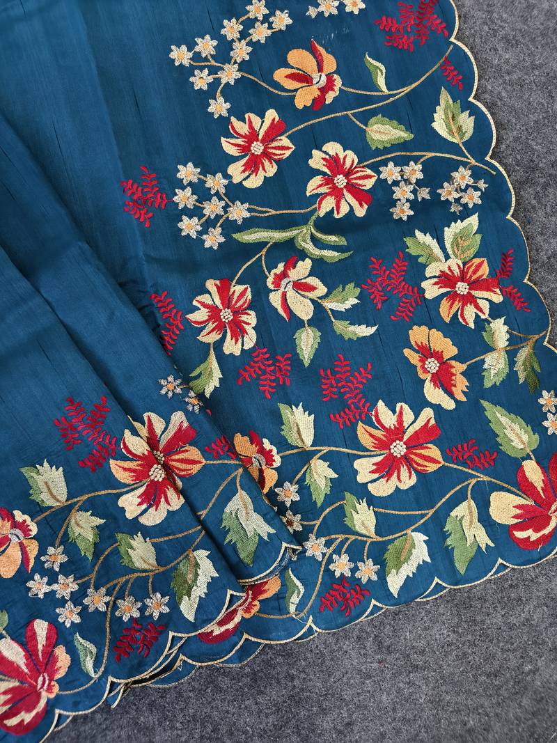 Blue matka silk saree with heavy floral embroidery border with running blouse