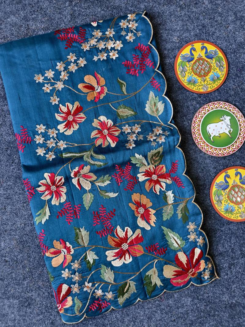 Blue matka silk saree with heavy floral embroidery border with running blouse