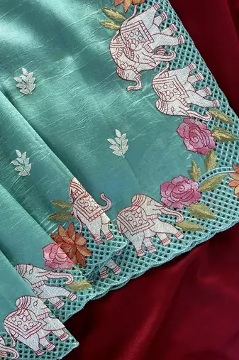 Sea-geen color embrodied elephant design panel with cutwork and hole work silk blend saree