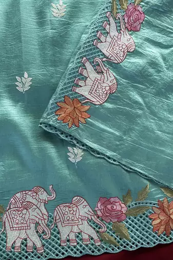 Sea-geen color embrodied elephant design panel with cutwork and hole work silk blend saree