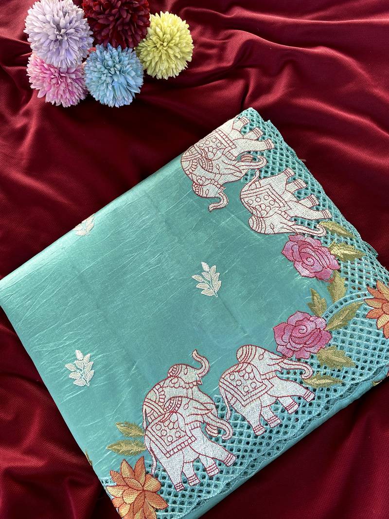 Sea-geen color embrodied elephant design panel with cutwork and hole work silk blend saree