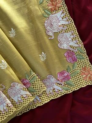 Yellow color embrodied elephant design panel with cutwork and hole work silk blend saree 1