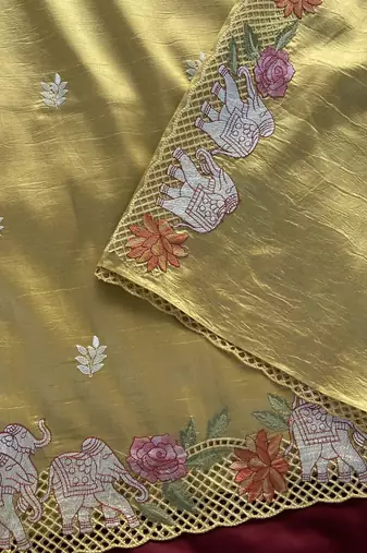 Yellow color embrodied elephant design panel with cutwork and hole work silk blend saree