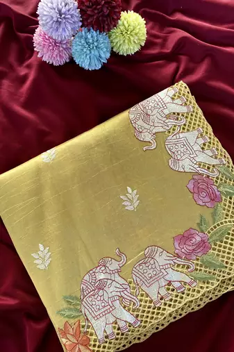 Yellow color embrodied elephant design panel with cutwork and hole work silk blend saree