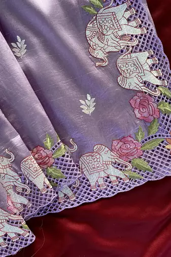 Lavender color embrodied elephant design panel with cutwork and hole work silk blend saree