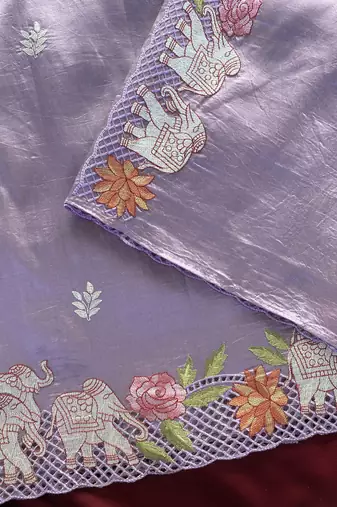 Lavender color embrodied elephant design panel with cutwork and hole work silk blend saree