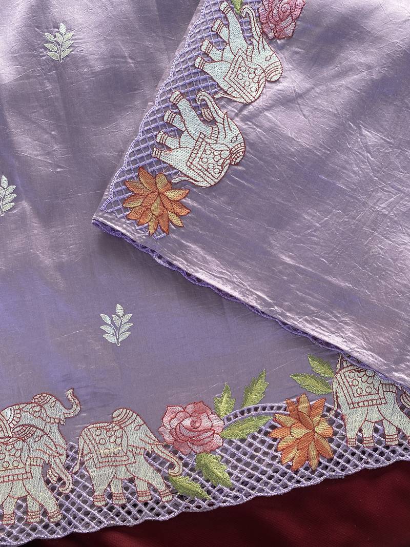 Lavender color embrodied elephant design panel with cutwork and hole work silk blend saree
