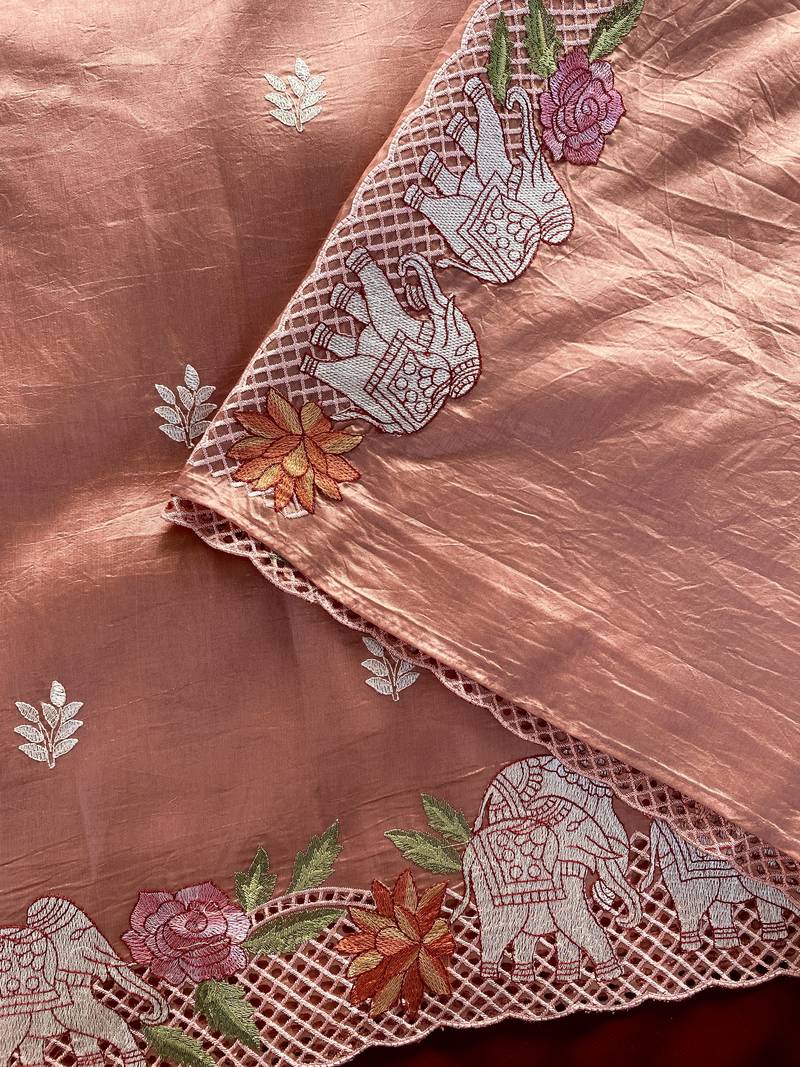 Orange color embrodied elephant design panel with cutwork and hole work silk blend saree