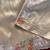 Beige color embrodied elephant design panel with cutwork and hole work viscose silk blend saree