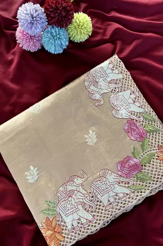 Beige color embrodied elephant design panel with cutwork and hole work viscose silk blend saree