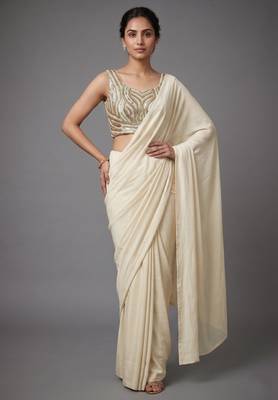 Cream beads work shiny georgette partywear saree with full of beads work blouse fabric. 1