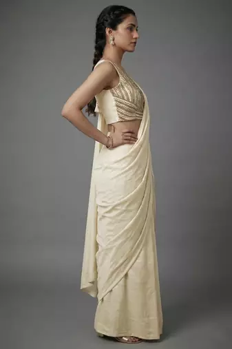 Cream beads work shiny georgette partywear saree with full of beads work blouse fabric.
