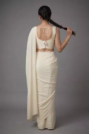 Cream beads work shiny georgette partywear saree with full of beads work blouse fabric.