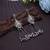 Rani & green color oxidised earrings